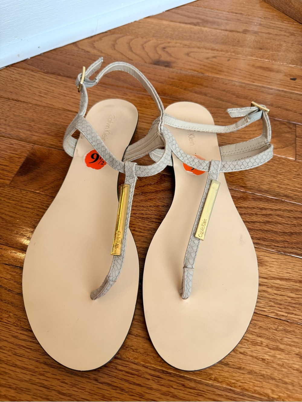 Calvin Klein Light Beige T-Strap Sandals with Gold Accent